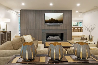 Peak Cabinets built-in cabinetry with fireplace, media storage, and modern living room design.